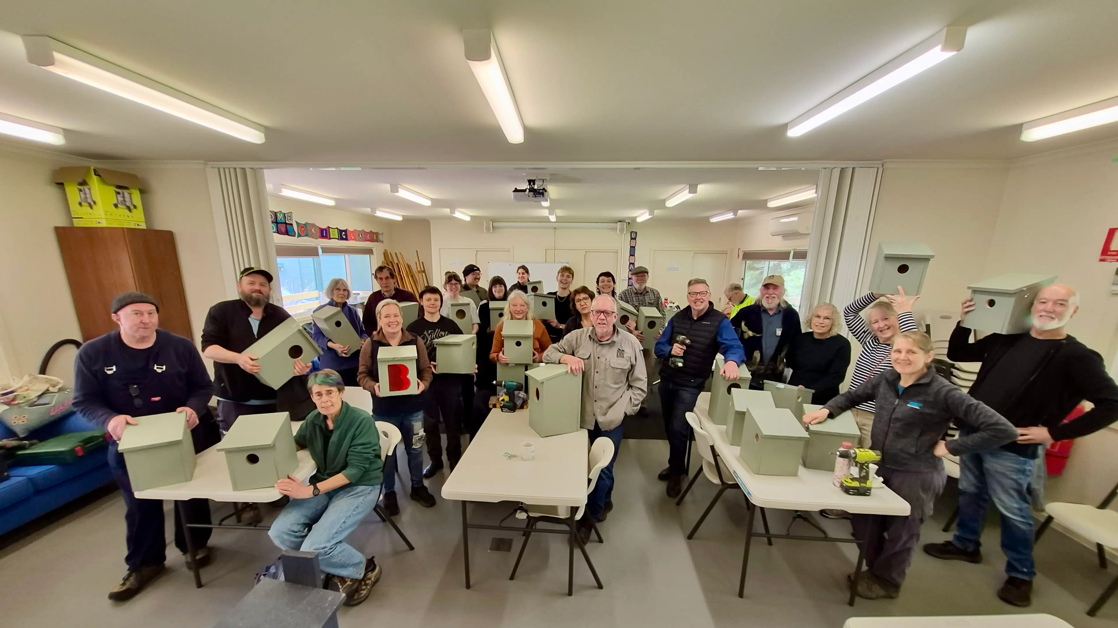 Participants build wooden nesting boxes to support environment