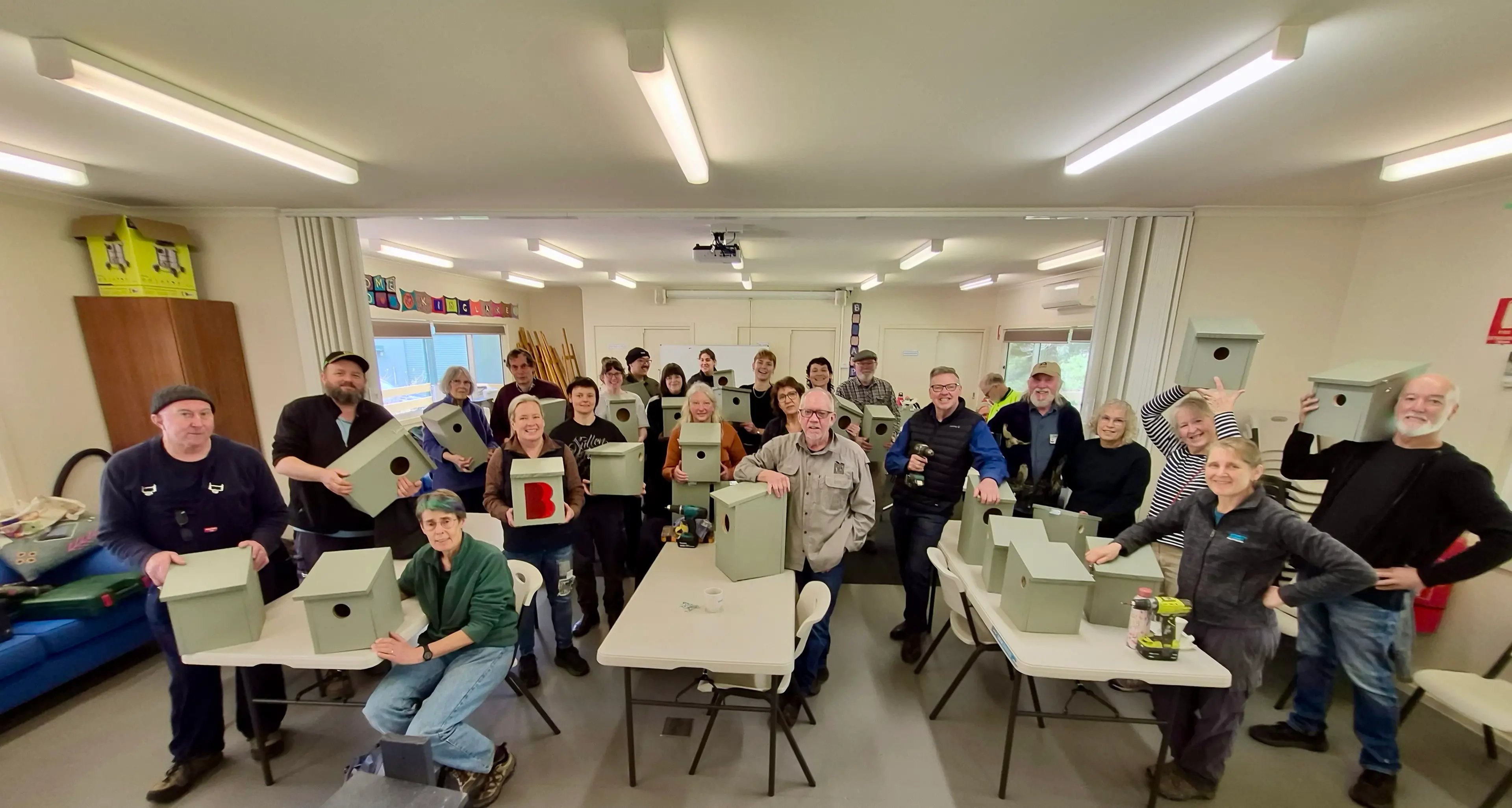 Participants build wooden nesting boxes to support environment