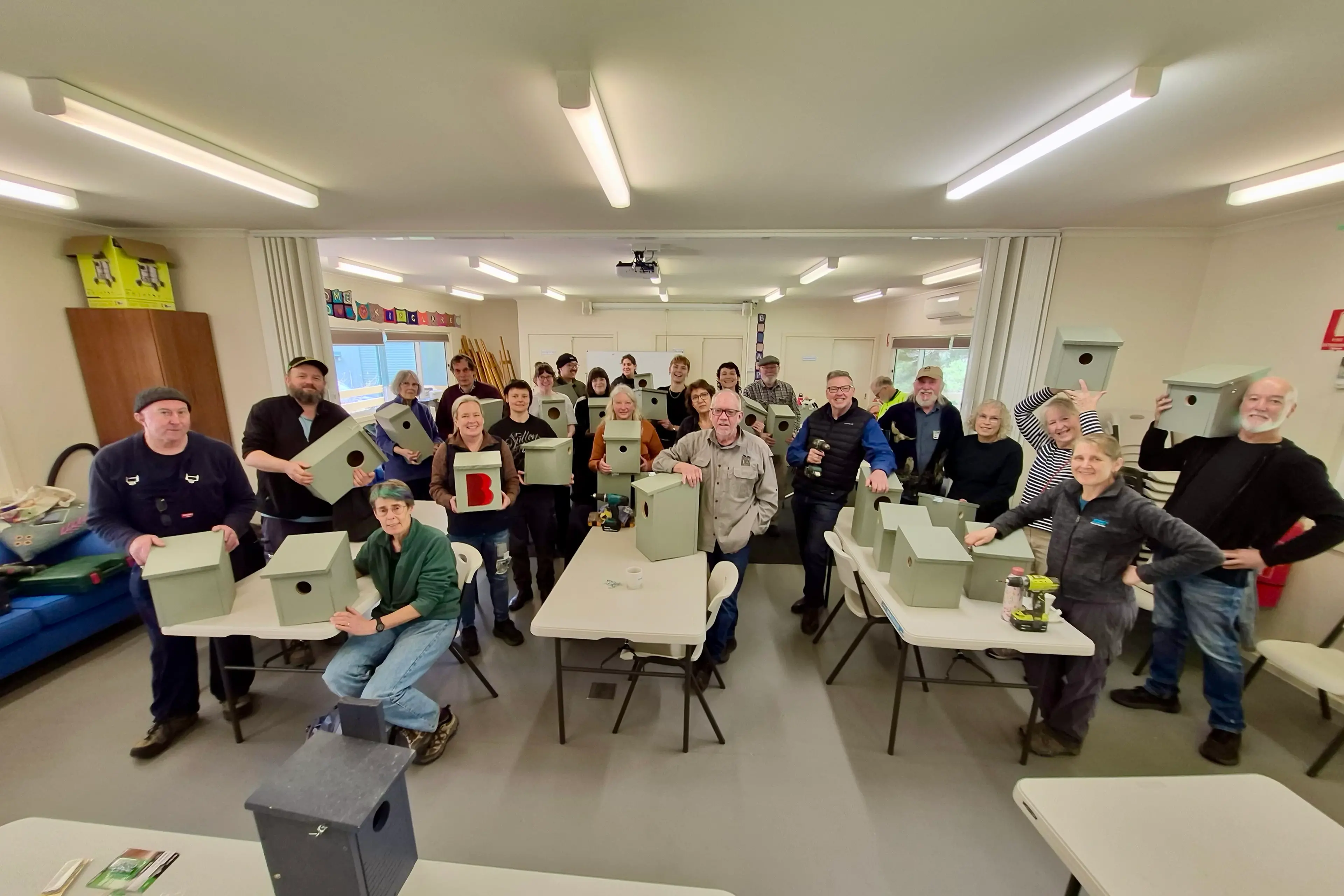 Participants build wooden nesting boxes to support environment