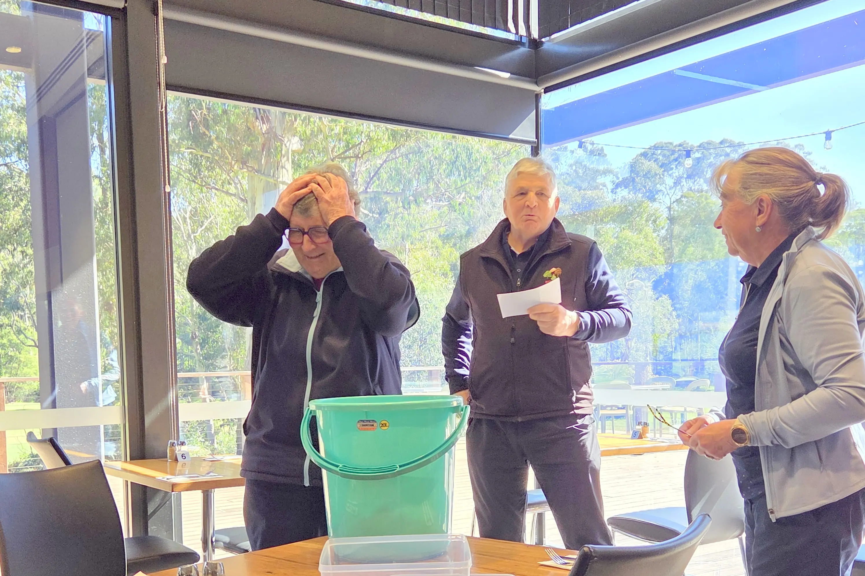 <p>SMALL ODDS: Lesley Rundle in shock after drawing her own name from the raffle, alongside Steve Coker and Heather Jenkins.</p>\\n