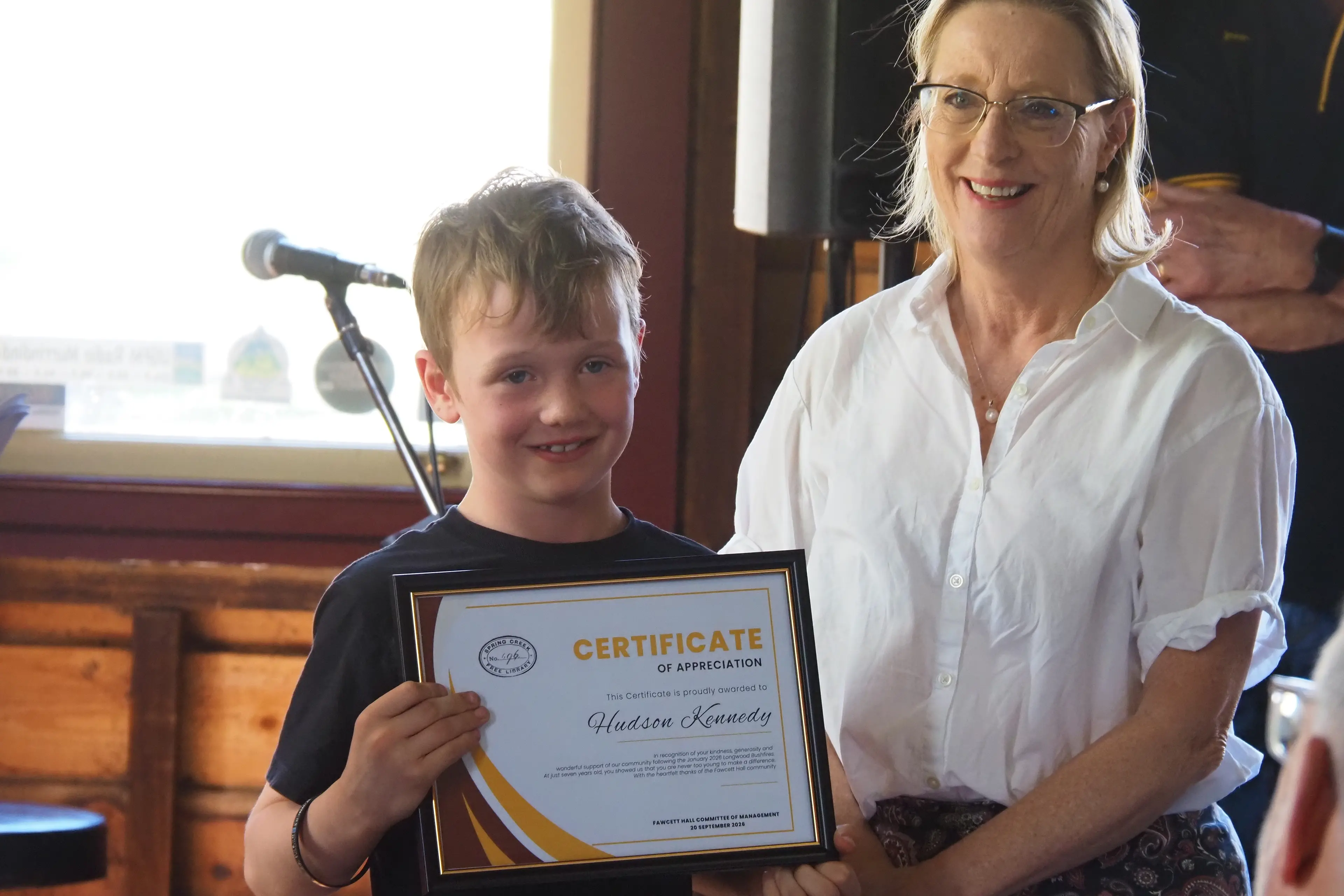 <p>COLLECTING CANS: Hudson collected cans to support the recovery effort. He is pictured here with Member for Eildon Cindy McLeish.</p>\\n