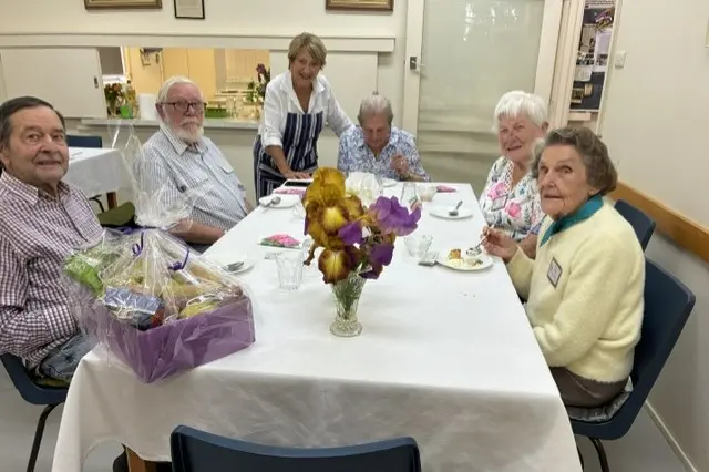 <p>TASTY TREATS: Club members enjoying lunch.</p>\\n